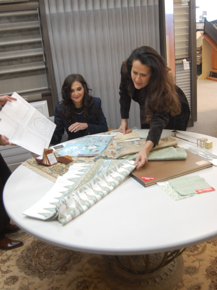 Interior designers looking at custom upholstery fabrics